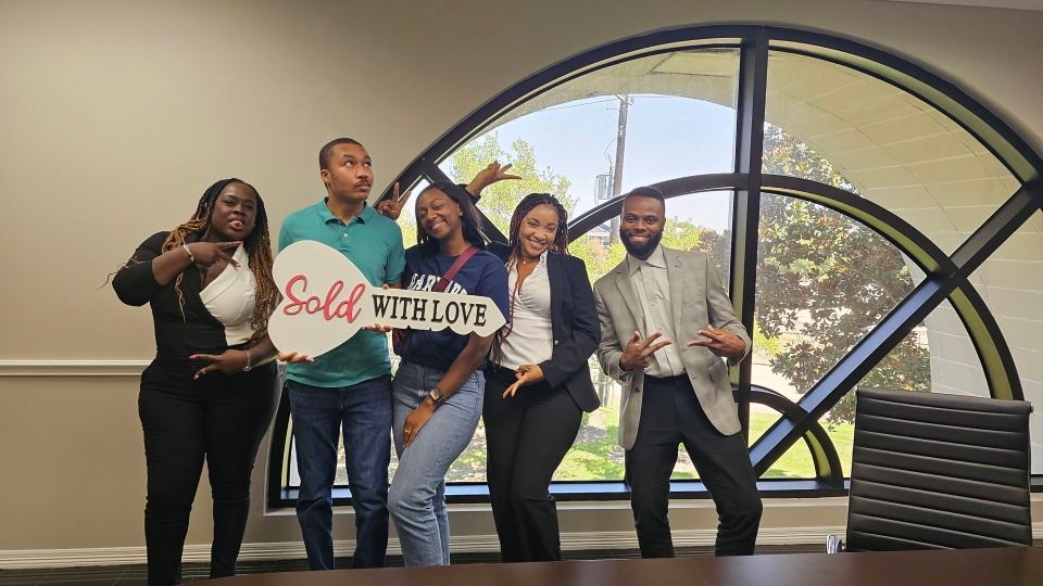 Game On Mortgage team celebrating a client's home sale